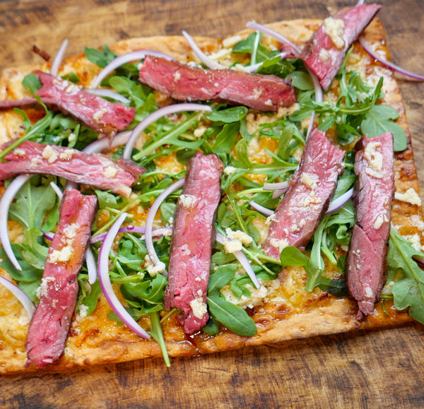 Steak and Arugula Flatbread With Parmesan Pecorino and Lemon Sauce