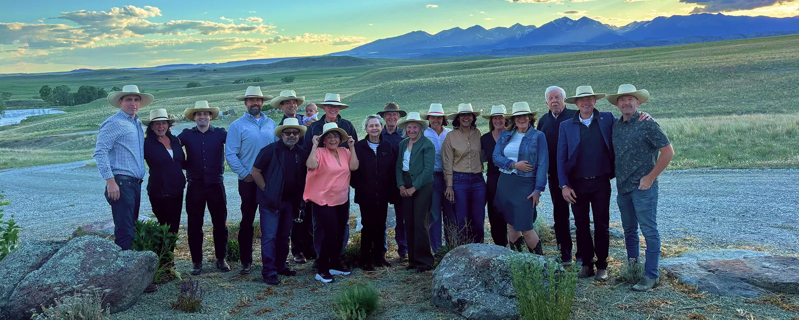 AV Event group photo with mountains in the distance